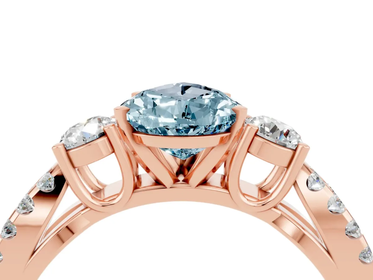 Pear Cut Aquamarine Three-Stone Ring with Pavé Split Shank and Four-Prong Setting Rose gold