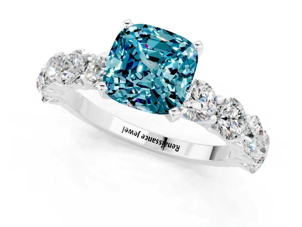 Cushion Cut Blue Topaz Prong Setting with Side Stones on a Pave Band Silver
