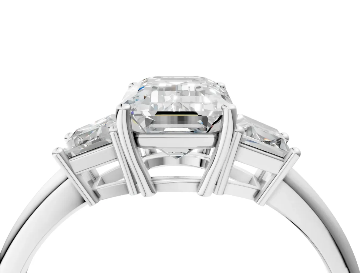 Emerald Cut Diamond Three-Stone Ring with Trapezoid Side Stones and Prong Setting Silver