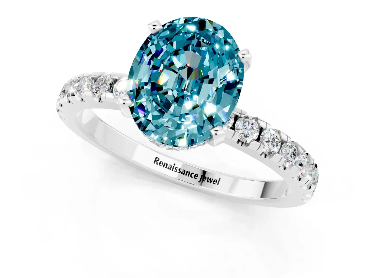 Oval Cut Blue Topaz Solitaire Ring with Round Pavé Band and Four-Prong Setting Silver