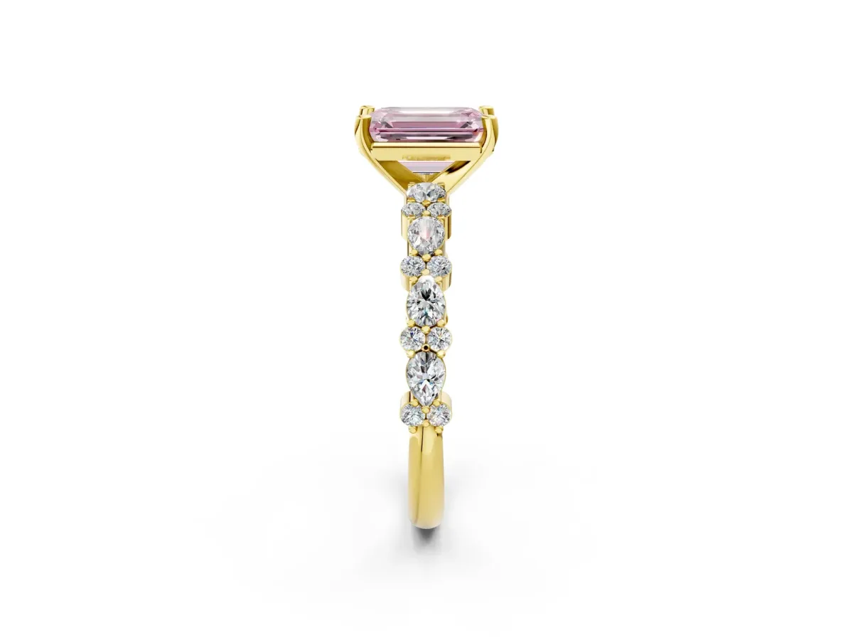 Fancy Pink Emerald Cut Diamond Side Stone Solitaire Ring with Round and Four-Prong Setting Yellow gold