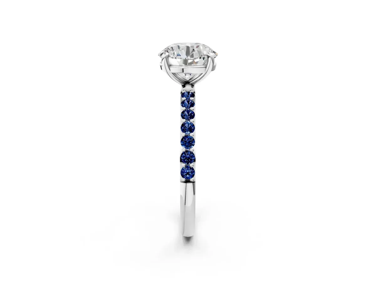 Round Cut Diamond Solitaire Ring with Round Blue Sapphire Pavé Band and Prong Setting Silver