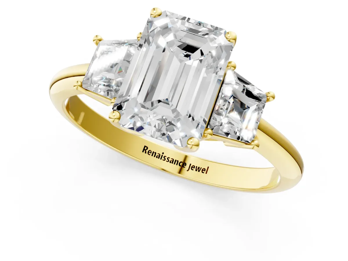 Emerald Cut Diamond Three-Stone Ring with Trapezoid Side Stones and Prong Setting Yellow gold
