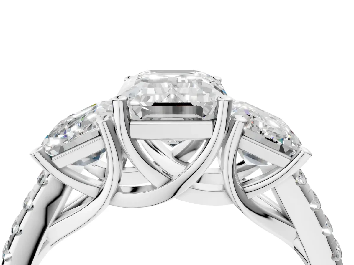 Three-Stone Emerald Cut Diamond Ring with Round Pavé Band and Prong Setting Platinum
