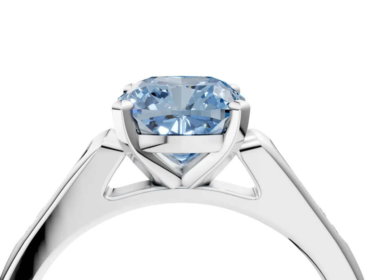 Fancy Blue Cushion Cut Diamond Solitaire Ring with Channel Set Round Band and Prong Setting Silver