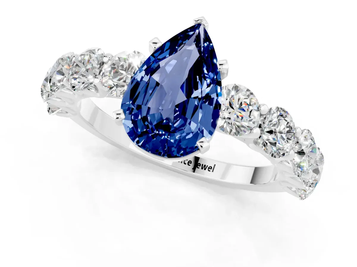 Pear Cut Blue Sapphire Prong Setting with Side Stones on a Pave Band Platinum