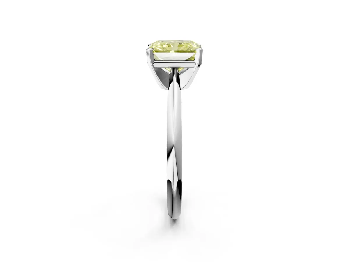 Fancy Yellow Radiant Cut Cut Solitaire Ring with Four-Prong Setting on a Classic Band Platinum