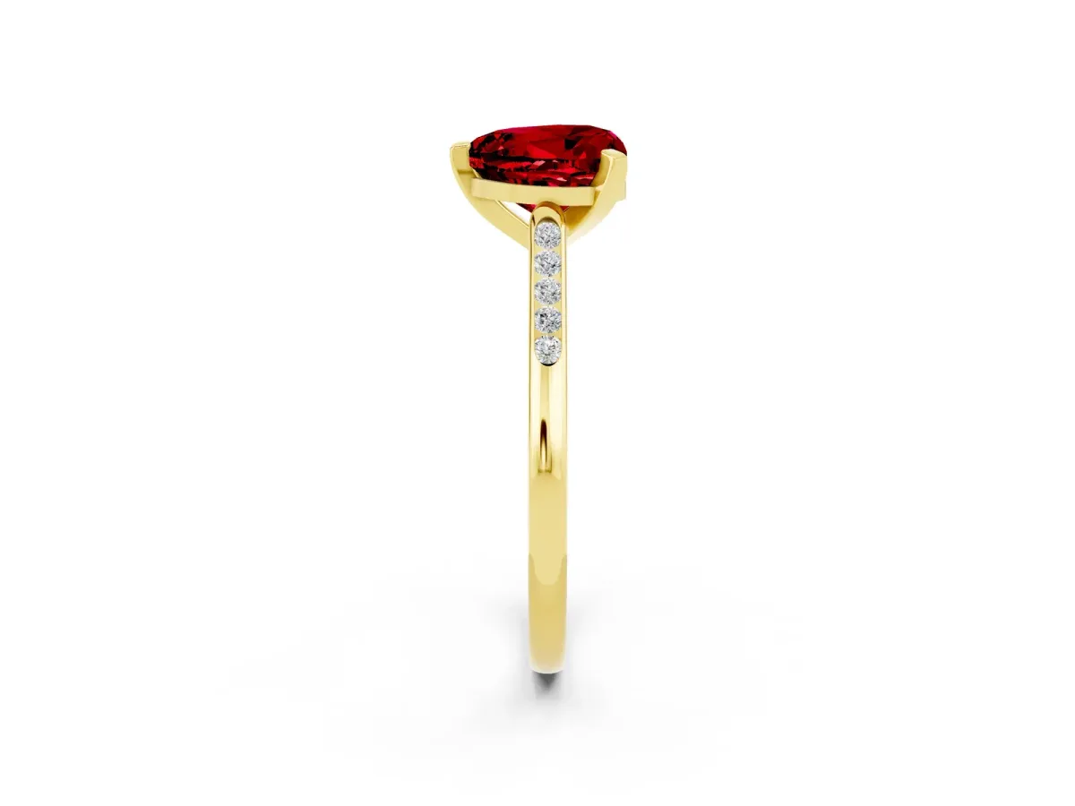 Heart Cut Ruby Solitaire Ring with Channel Set Round Band and Prong Setting Yellow gold