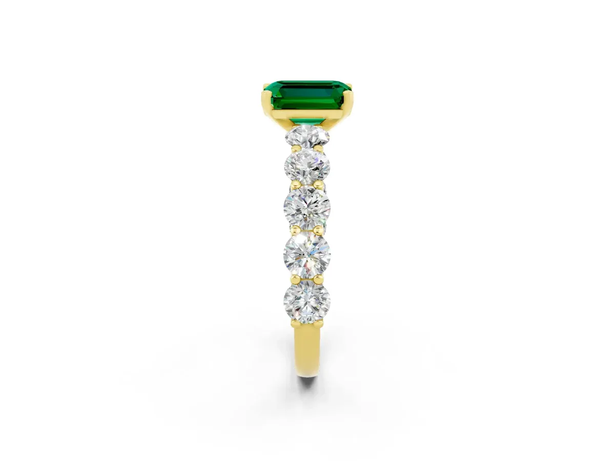 Emerald Cut Emerald Prong Setting with Side Stones on a Pave Band Yellow gold