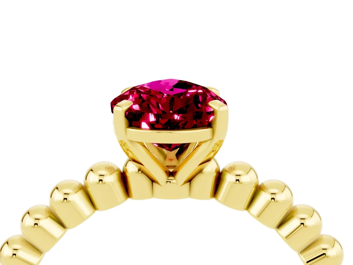 Pear Cut Garnet Solitaire Ring with Beaded Band and Prong Setting Yellow gold