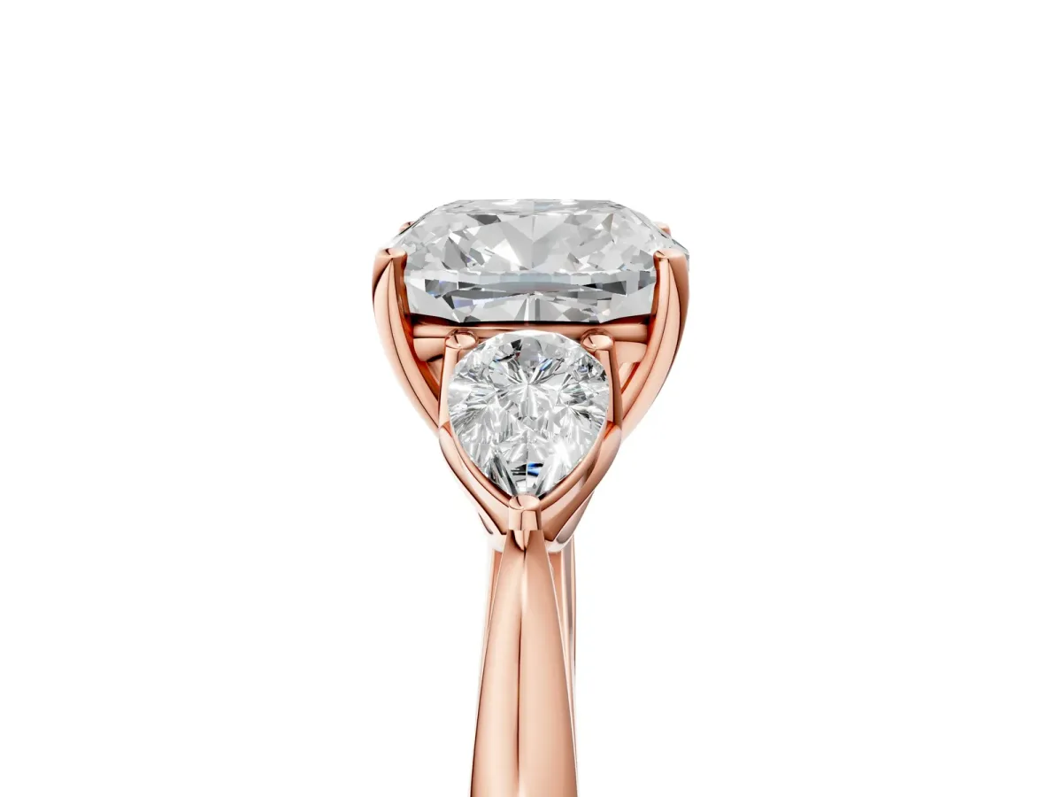 Cushion Cut Diamond Three-Stone Ring with Pear Side Stones and Prong Setting Rose gold