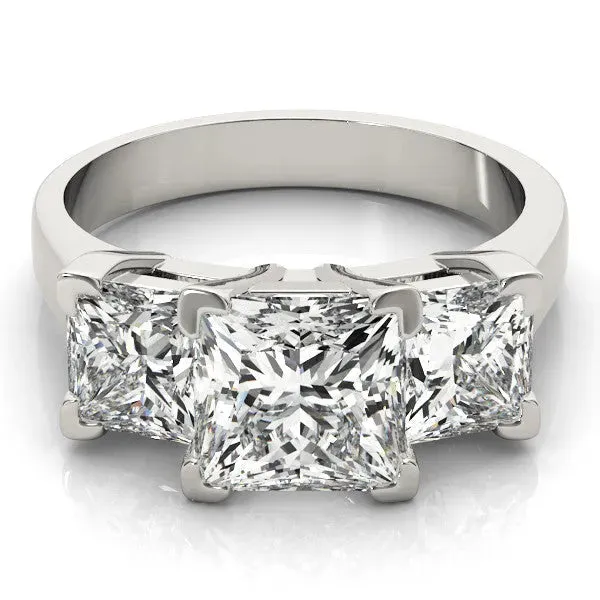 Three-Stone Pear Cut Cut Diamond Ring with Channel Set Band and Four-Prong Setting Platinum