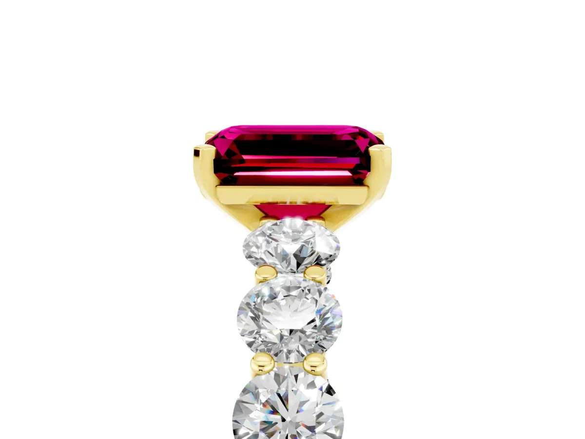 Emerald Cut Garnet Prong Setting with Side Stones on a Pave Band Yellow gold