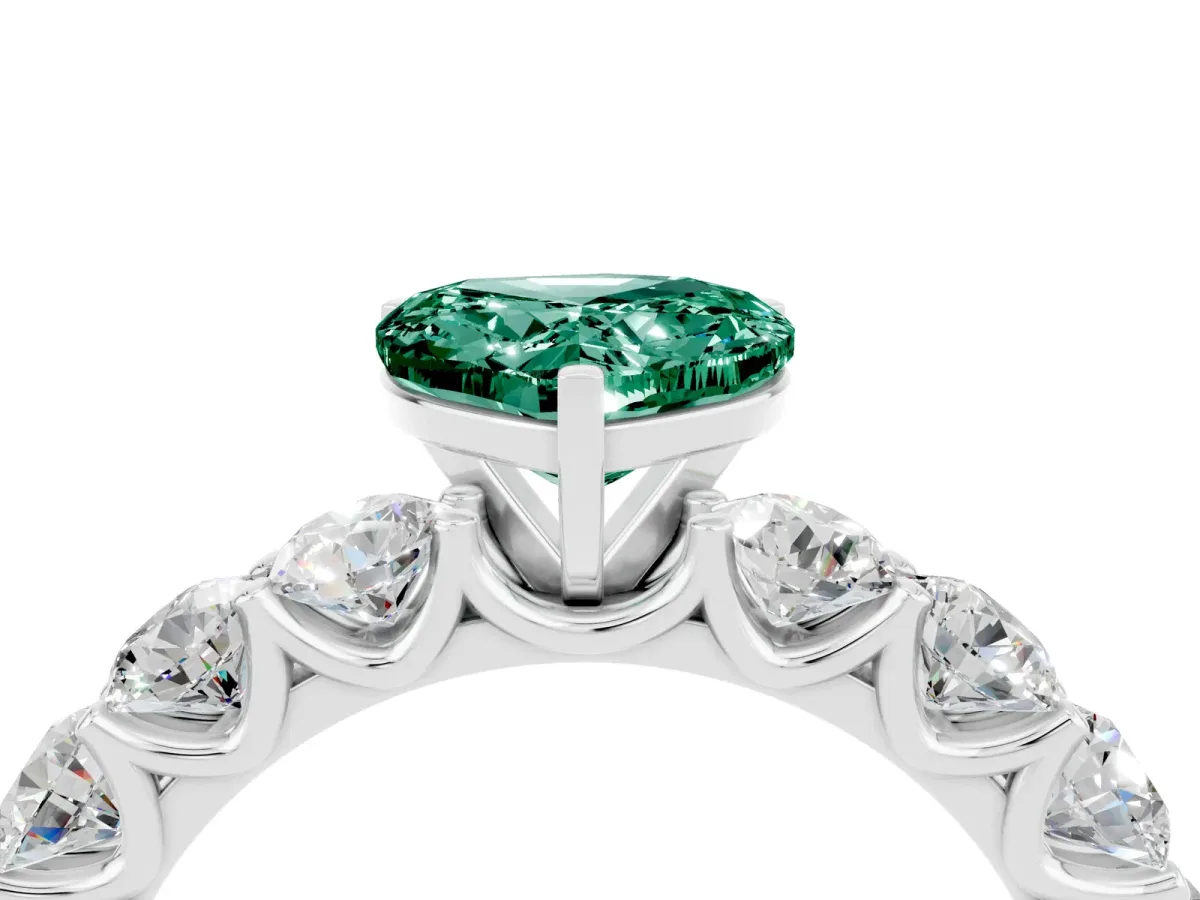 Heart Cut Green Sapphire Prong Setting with Side Stones on a Pave Band Silver