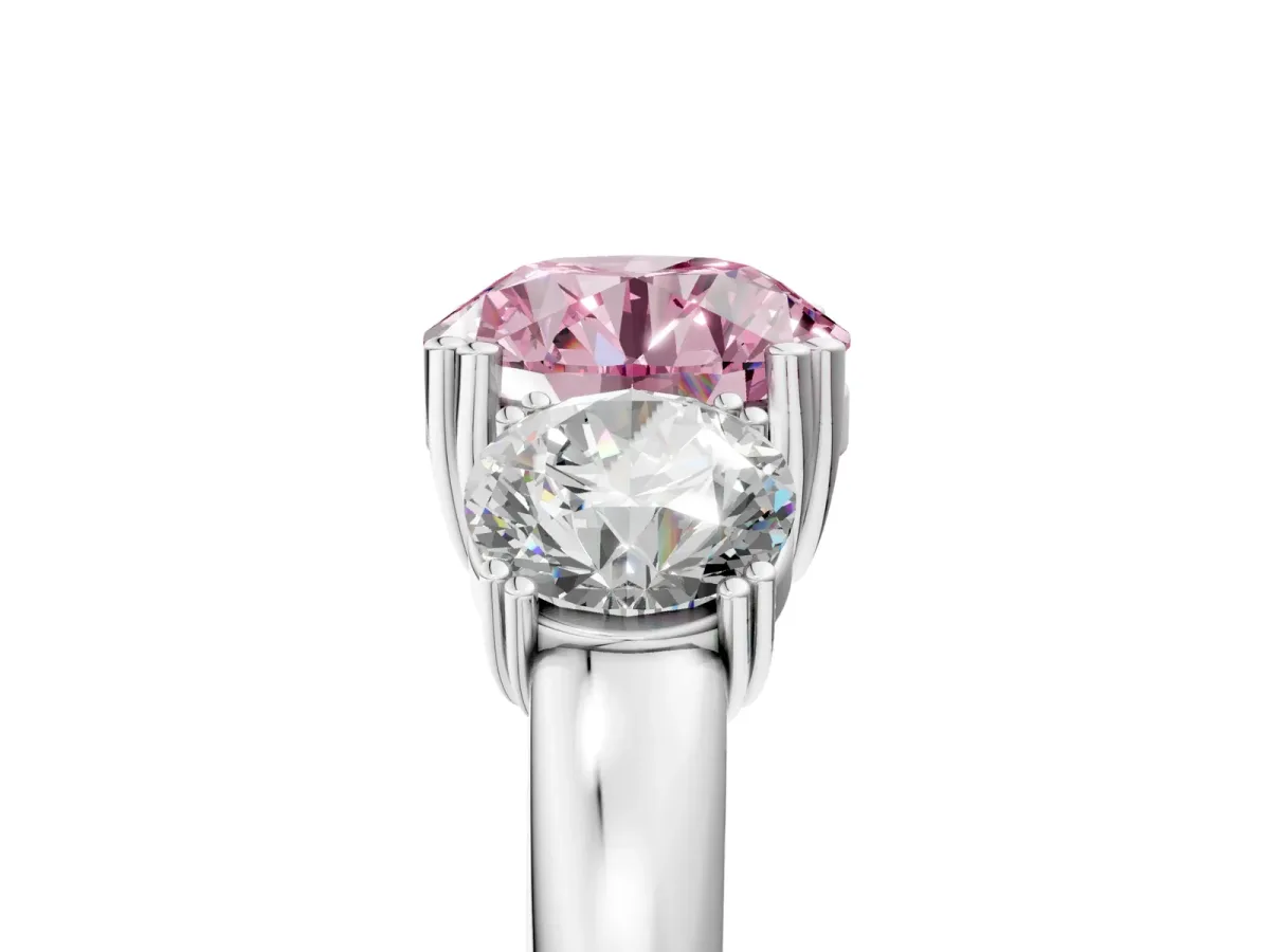 Fancy Pink Three-Stone Round Cut Cut Diamond Ring with Channel Set Band and Four-Prong Setting Silver