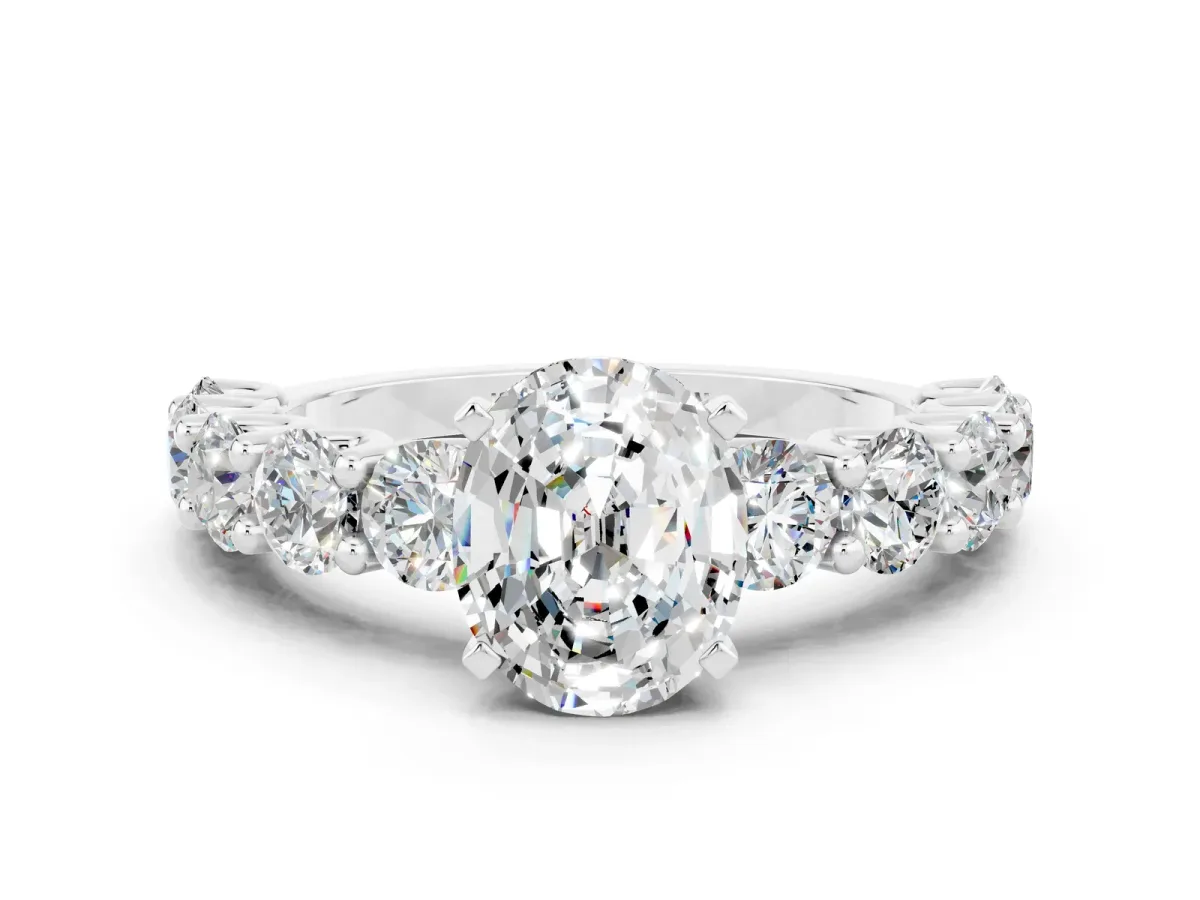 Oval Cut Moissanite Prong Setting with Side Stones on a Pave Band Silver