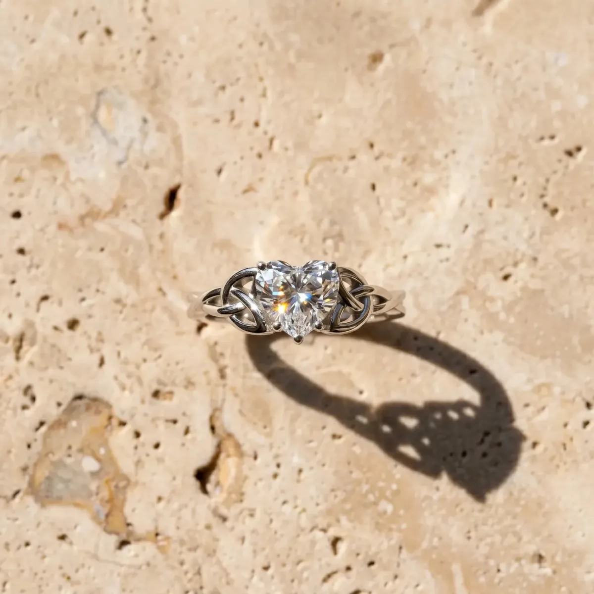 Heart Cut Diamond Solitaire Engagement Ring with Celtic Knot Band and Four-Prong Setting Silver