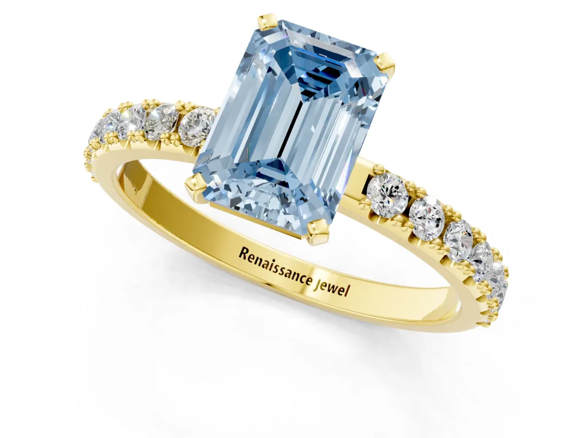 Fancy Blue Emerald Cut Diamond Solitaire Pavé Band with Four-Prong Setting Yellow gold