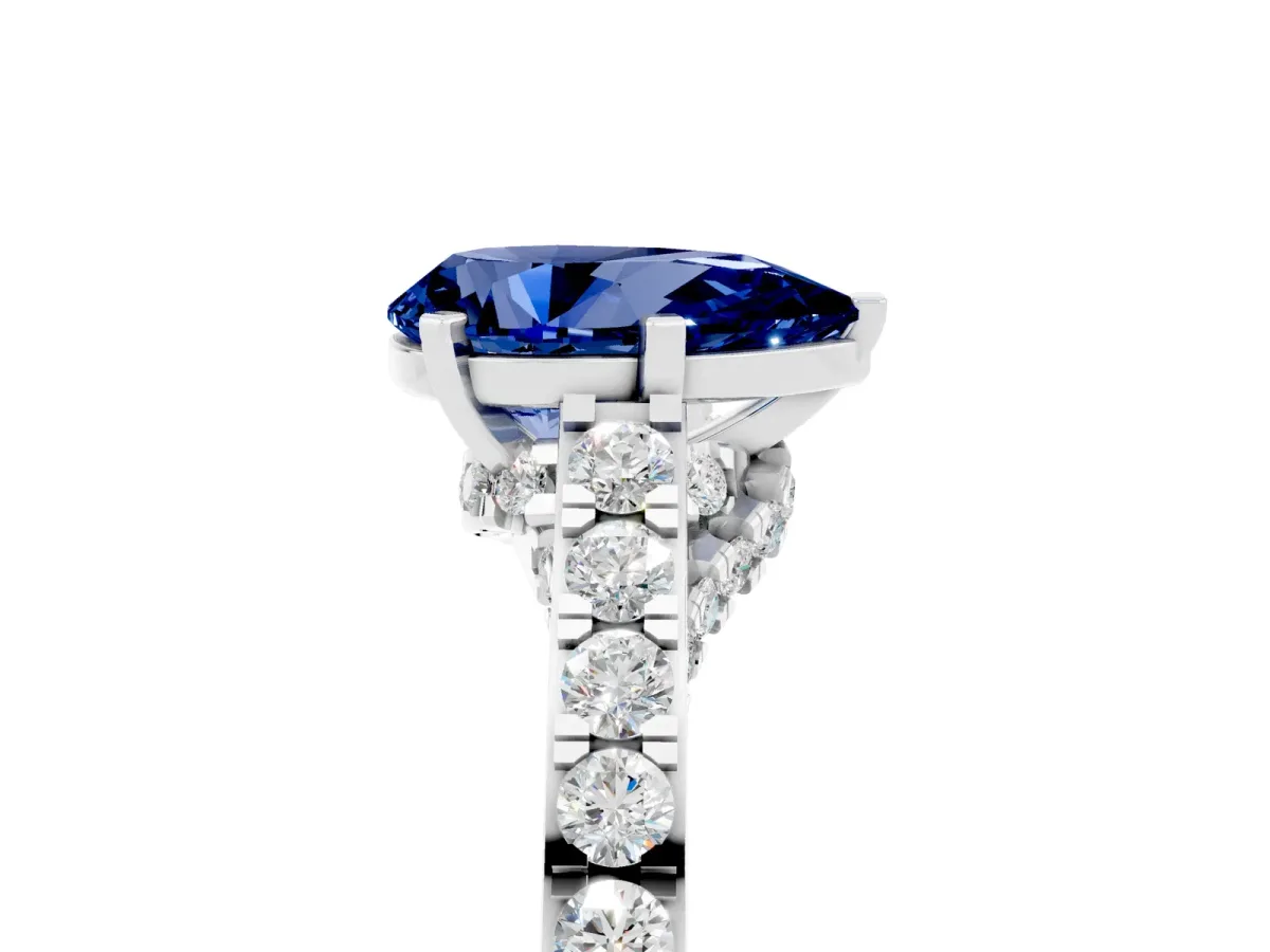 Pear Cut Blue Sapphire Solitaire Ring with Crossover Gallery and Round Pavé Band Silver
