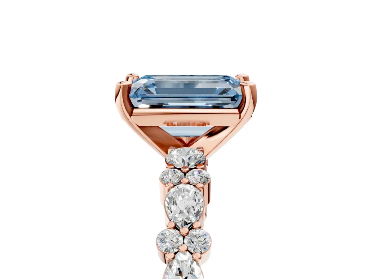 Fancy Blue Emerald Cut Diamond Side Stone Solitaire Ring with Round and Four-Prong Setting Rose gold