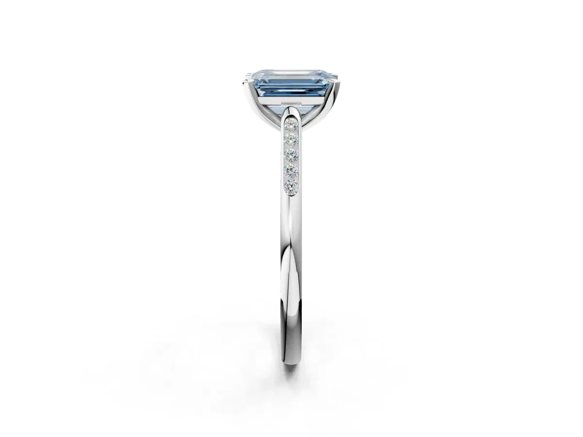 Fancy Blue Emerald Cut Diamond Solitaire Ring with Channel Set Round Band and Prong Setting White gold