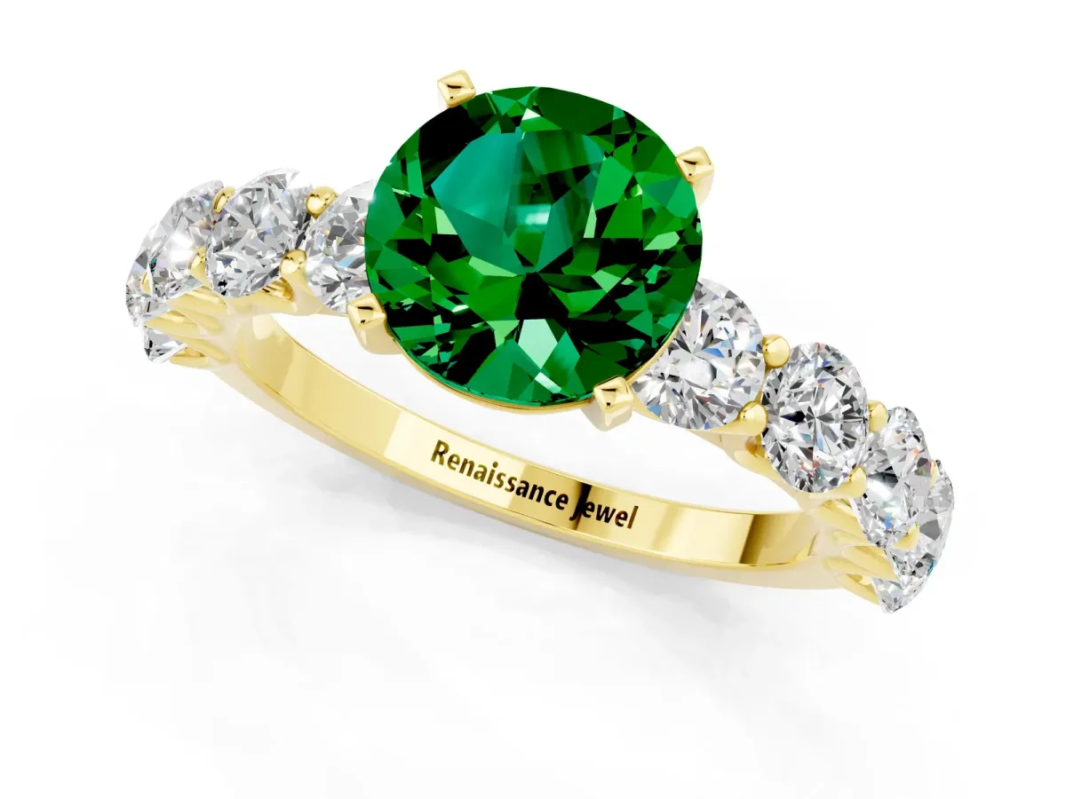 Round Cut Emerald Prong Setting with Side Stones on a Pave Band Yellow gold