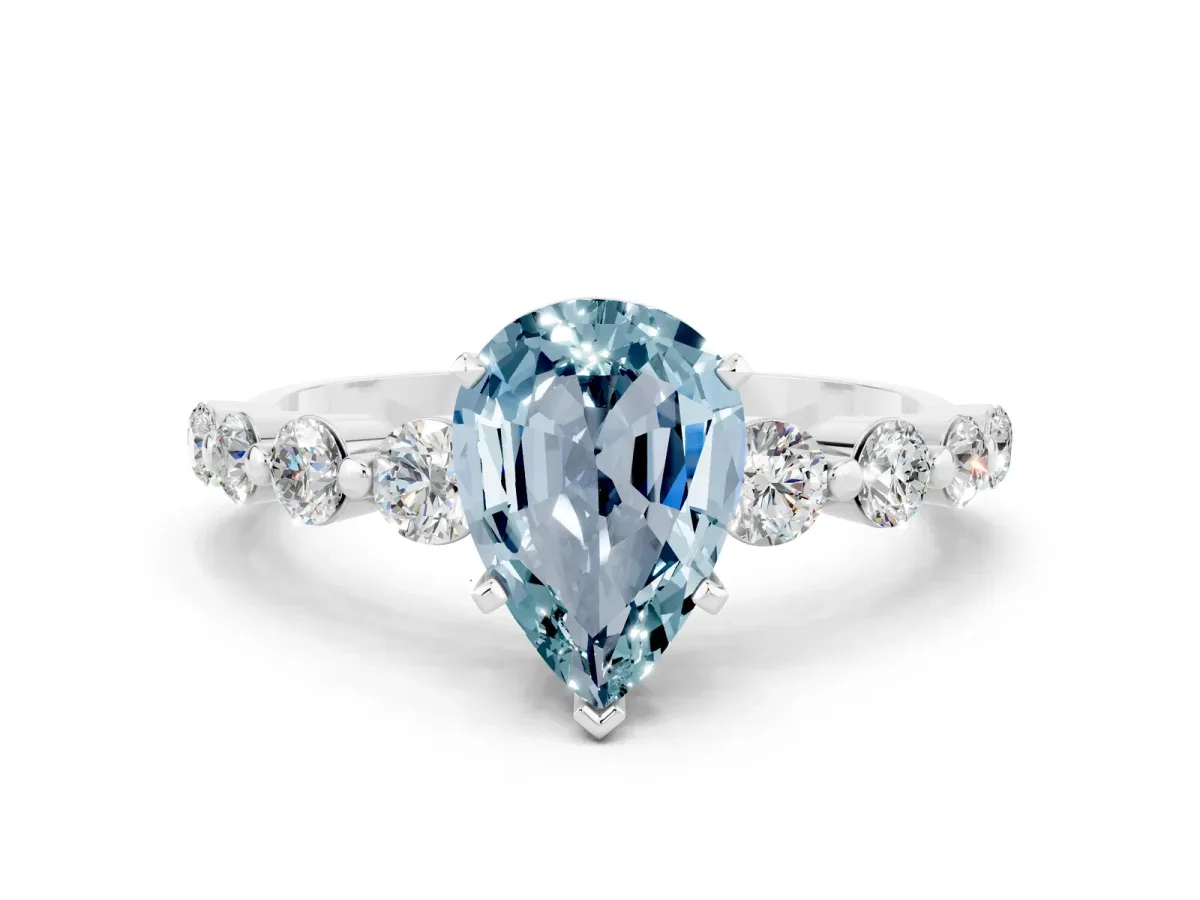 Pear Cut Solitaire Aquamarine Ring with Pave Band and Four-Prong Setting Silver