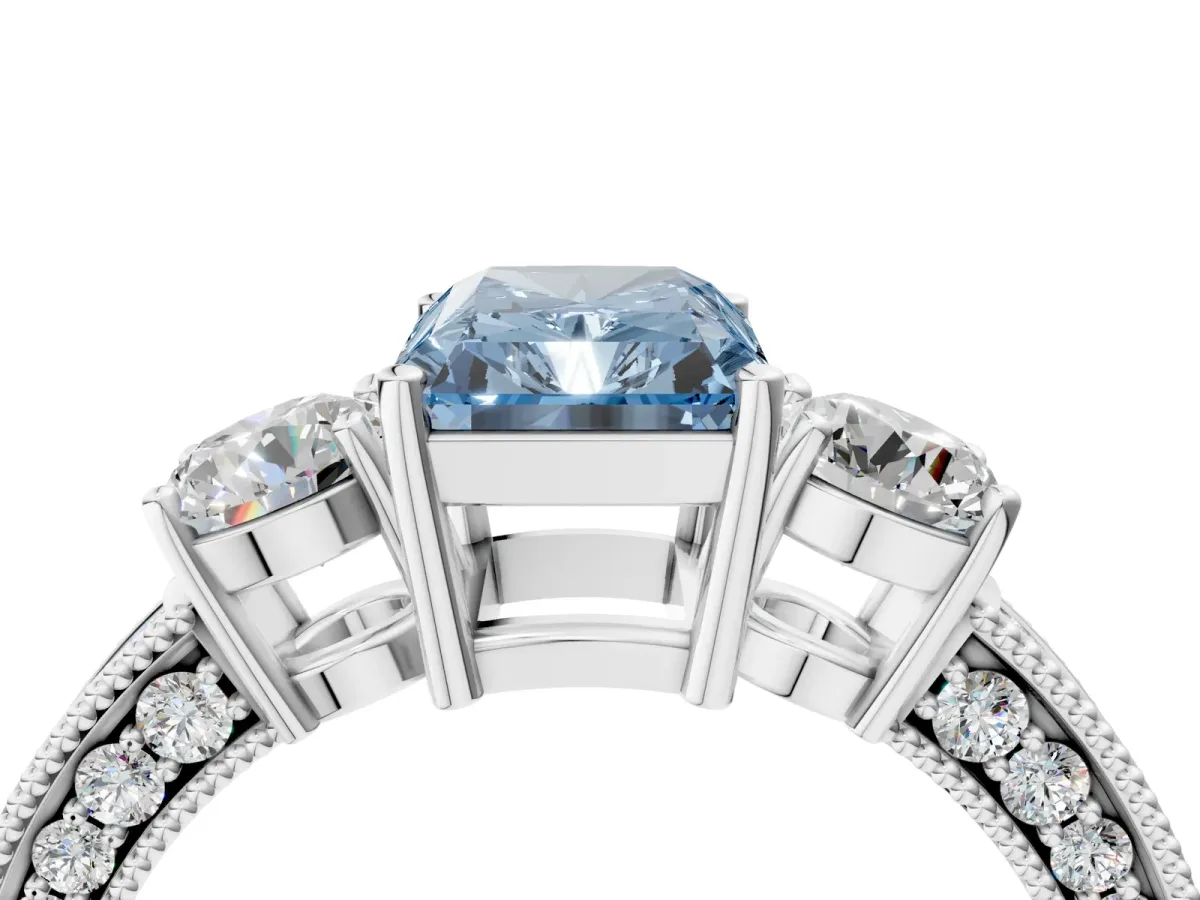Fancy Blue Radiant Cut Three-Stone Diamond Ring with Pavé Band and Four-Prong Setting Platinum