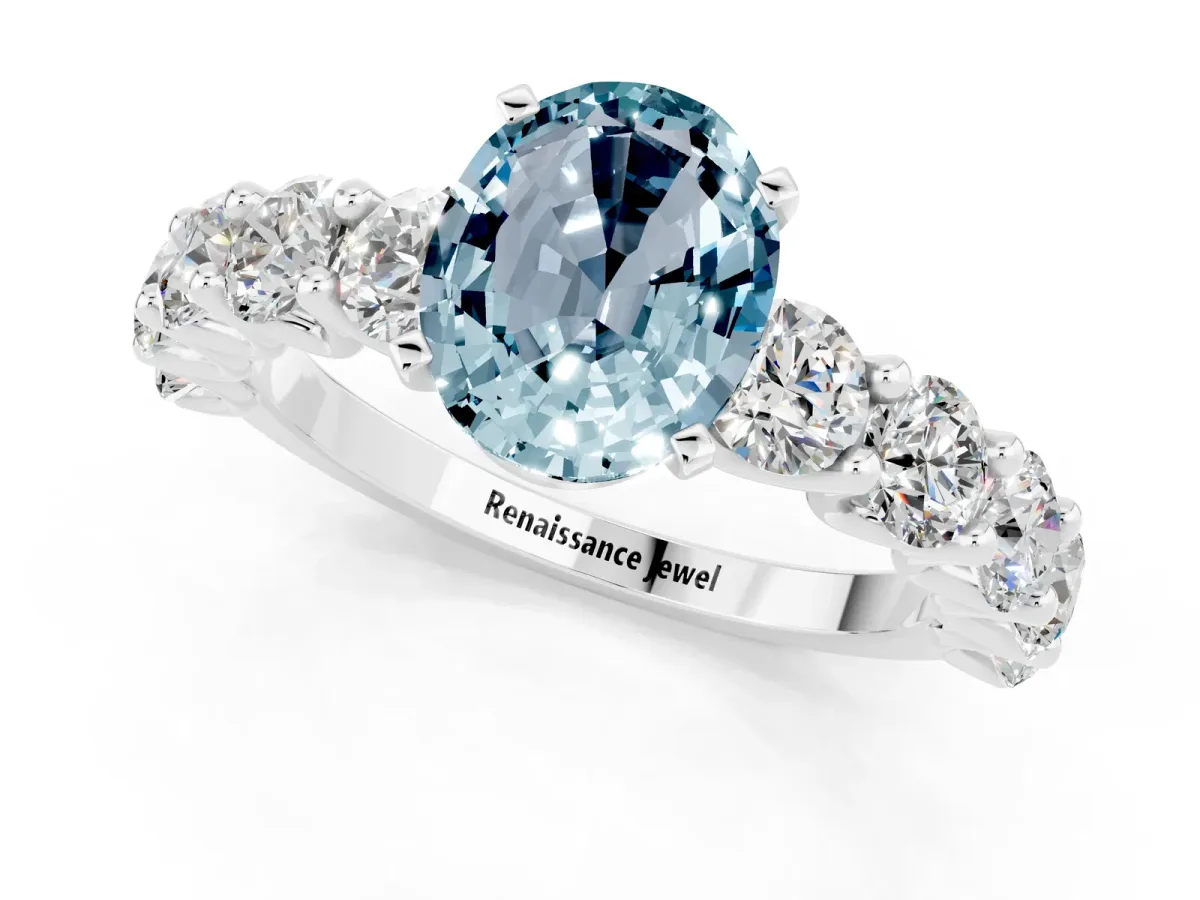 Oval Cut Aquamarine Prong Setting with Side Stones on a Pave Band Silver