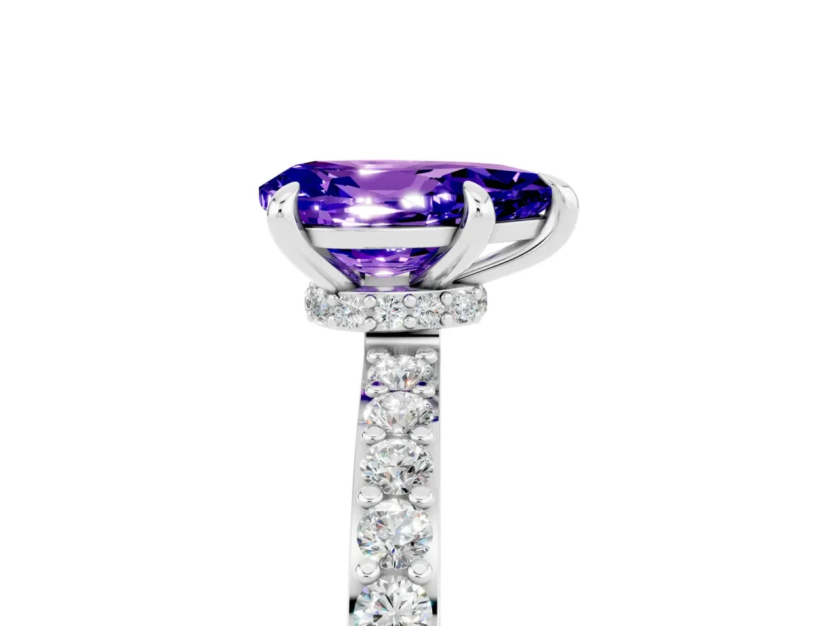 Pear Cut Tanzanite Solitaire Engagement Ring with Pavé Band and Four-Prong Setting Silver