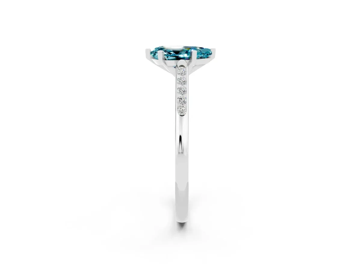 Pear Cut Blue Topaz Solitaire Ring with Channel Set Round Band and Prong Setting Silver