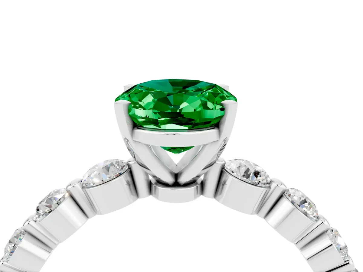 Oval Cut Solitaire Emerald Ring with Pave Band and Four-Prong Setting Silver