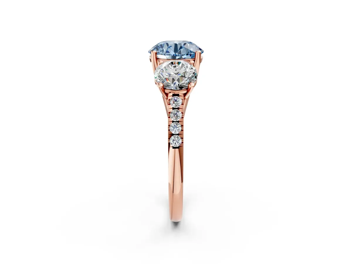 Fancy Blue Three-Stone Round Cut Diamond Ring with Round Pavé Band and Prong Setting Rose gold