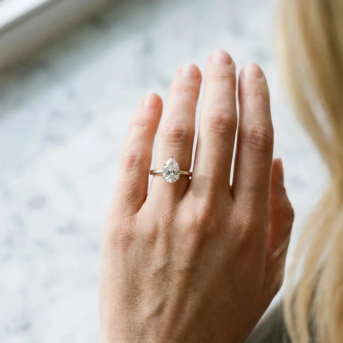Pear Cut Diamond Solitaire Engagement Ring with Classic Band and Four-Prong Setting Silver