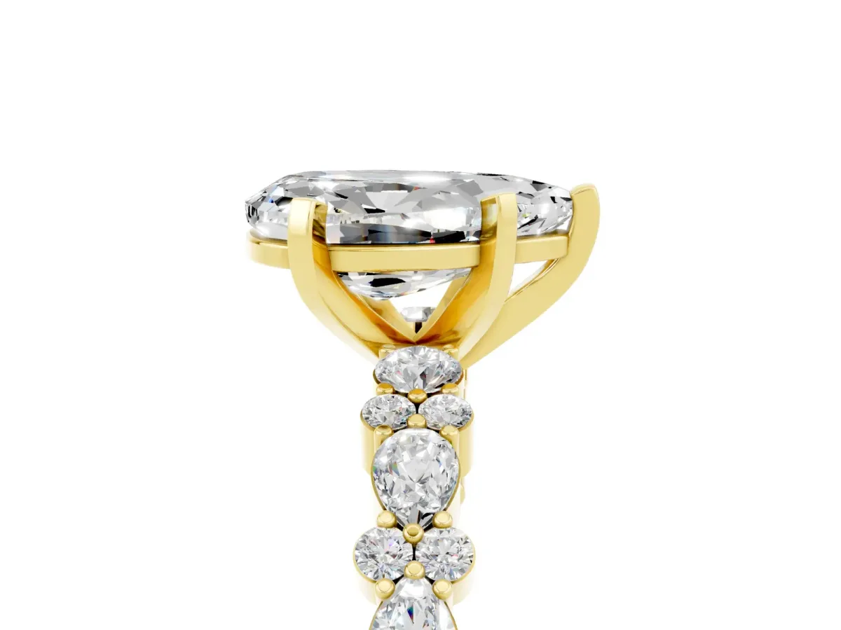 Pear Cut Moissanite Side Stone Solitaire Ring with Round and Four-Prong Setting Yellow gold