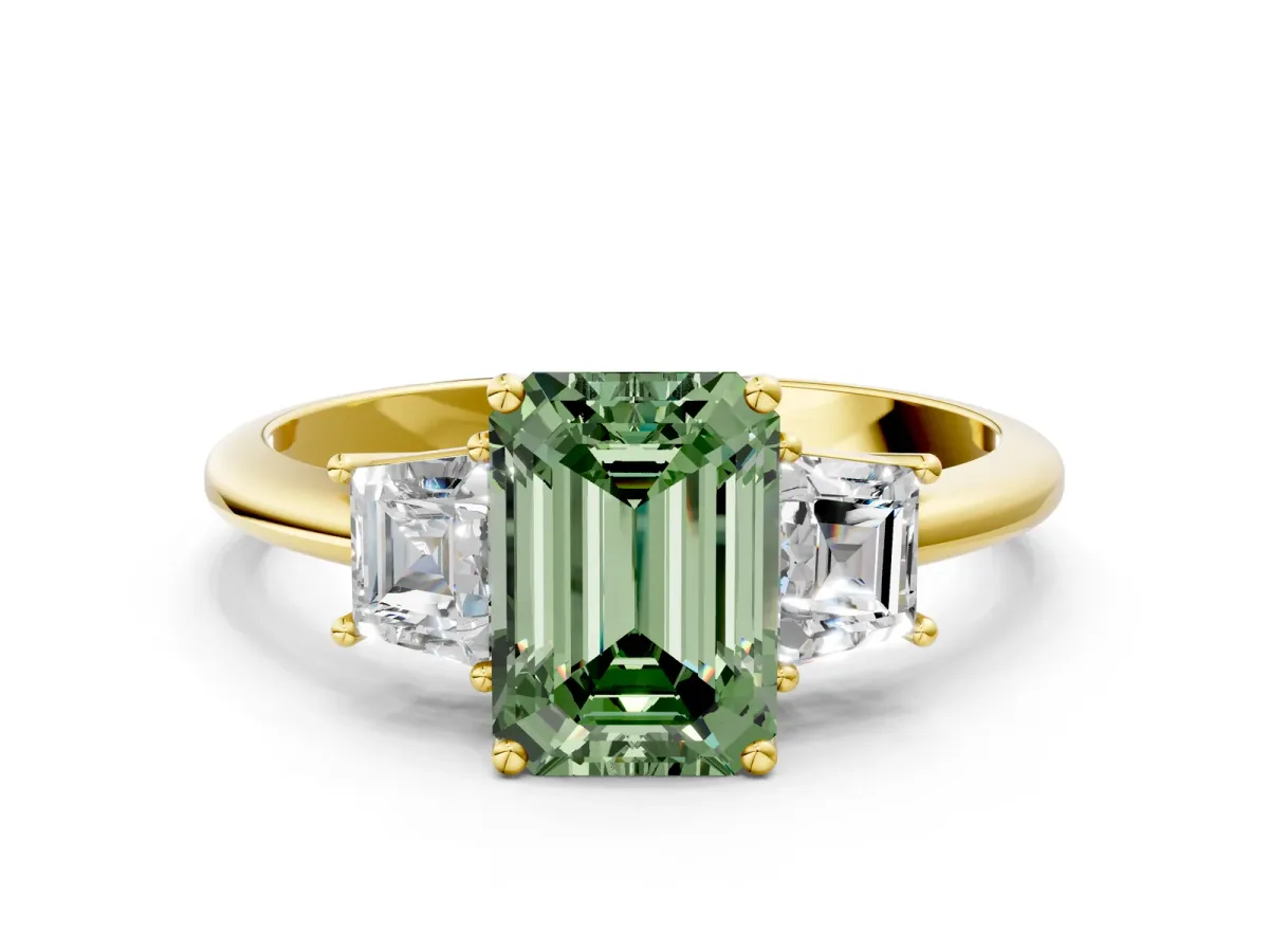 Fancy Green Emerald Cut Diamond Three-Stone Ring with Trapezoid Side Stones and Prong Setting Yellow gold