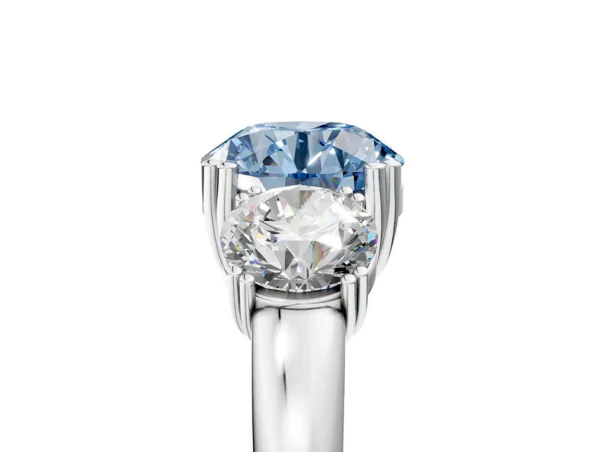 Fancy Blue Three-Stone Round Cut Cut Diamond Ring with Channel Set Band and Four-Prong Setting Platinum