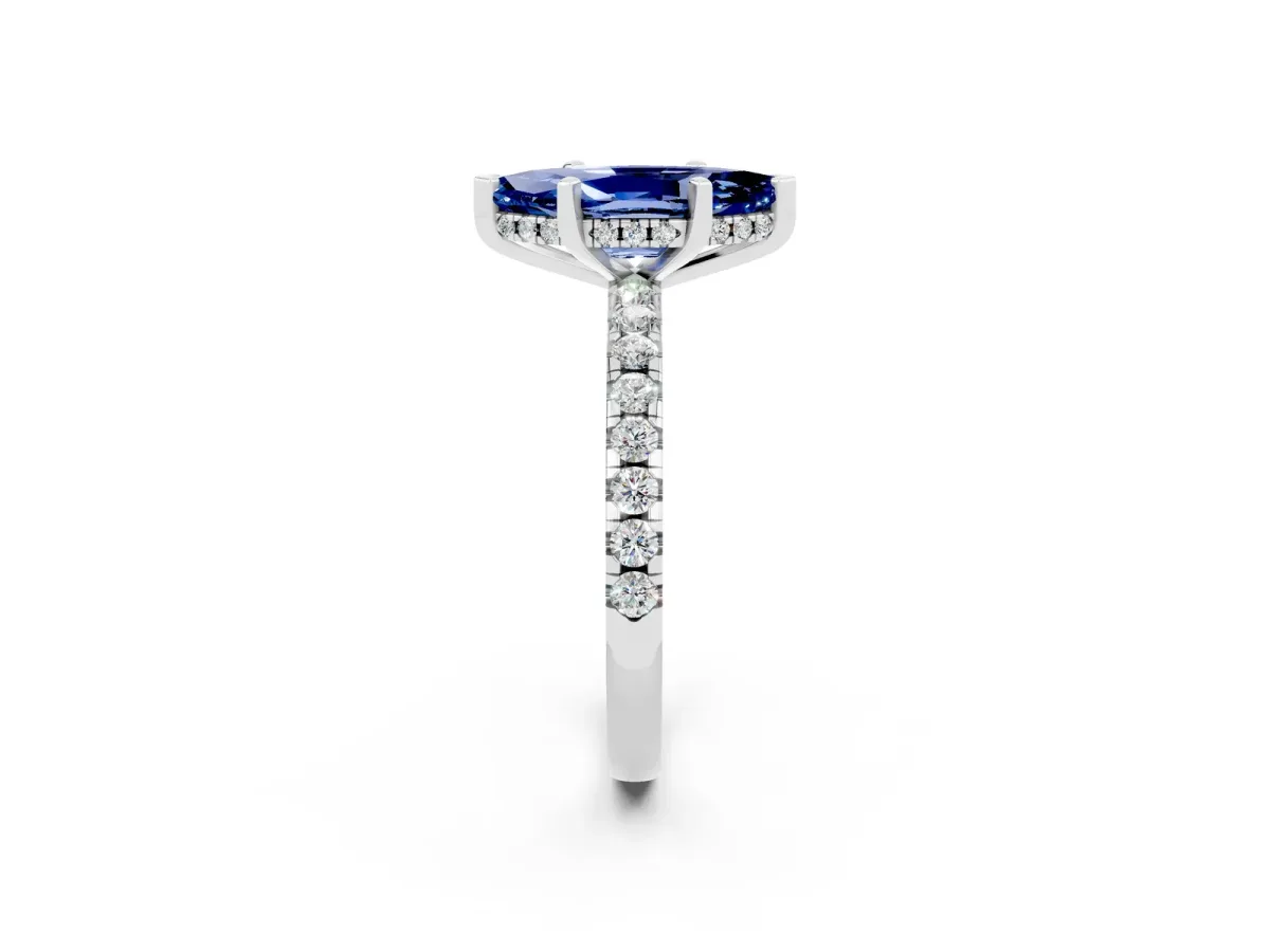 Marquise Cut Blue Sapphire Solitaire Ring with Round Pavé Band and Four-Prong Setting Silver