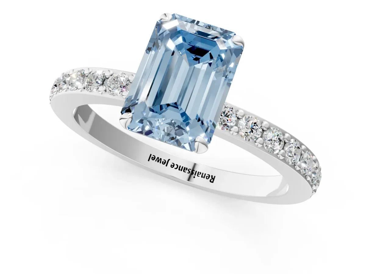 Fancy Blue Emerald Cut Diamond Solitaire Engagement Ring with Pavé Band and Four-Prong Setting Silver