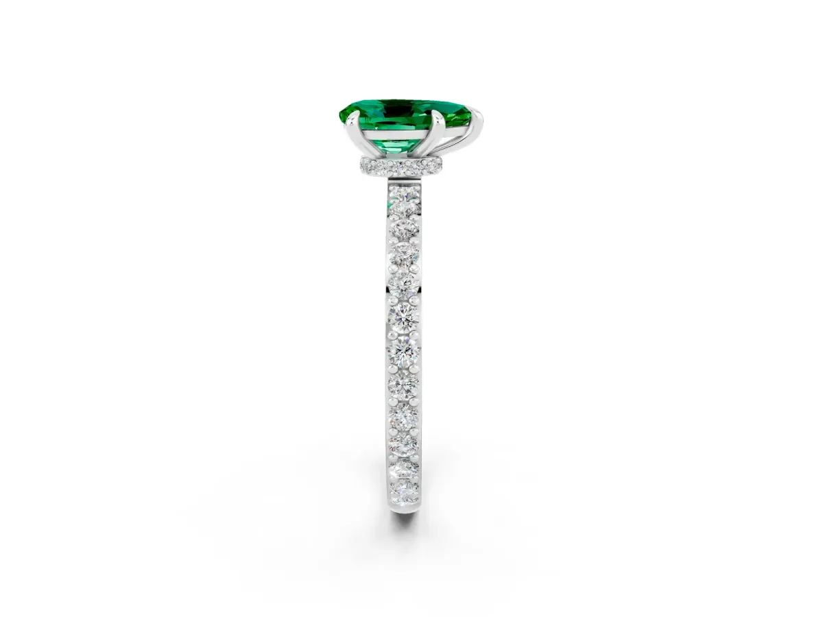 Pear Cut Emerald Solitaire Engagement Ring with Pavé Band and Four-Prong Setting Silver