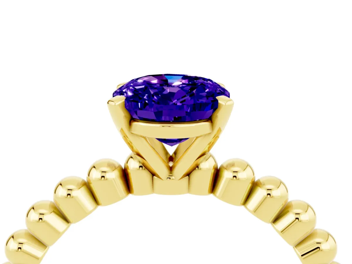 Oval Cut Tanzanite Solitaire Ring with Beaded Band and Prong Setting Yellow gold
