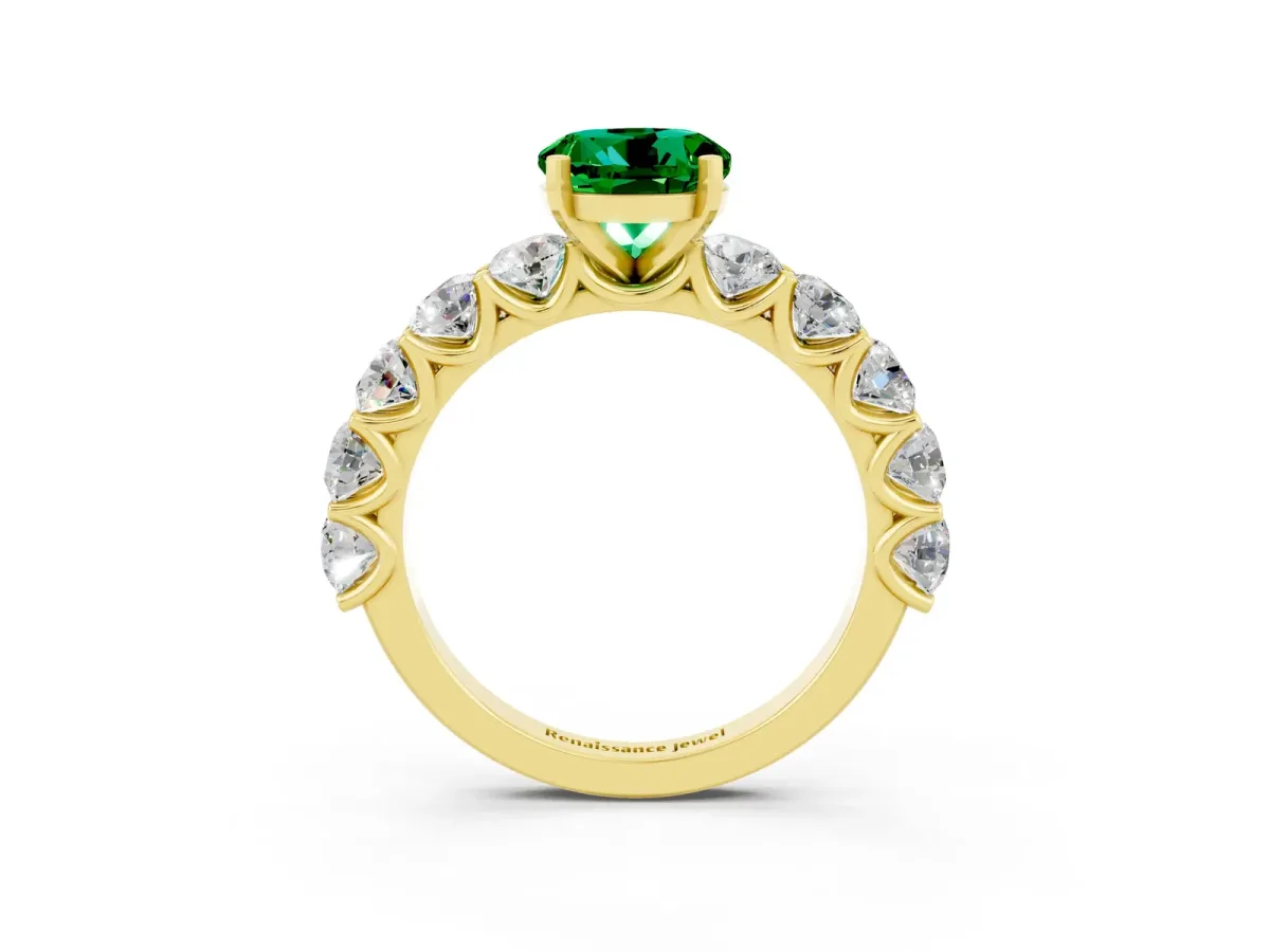Round Cut Emerald Prong Setting with Side Stones on a Pave Band Yellow gold