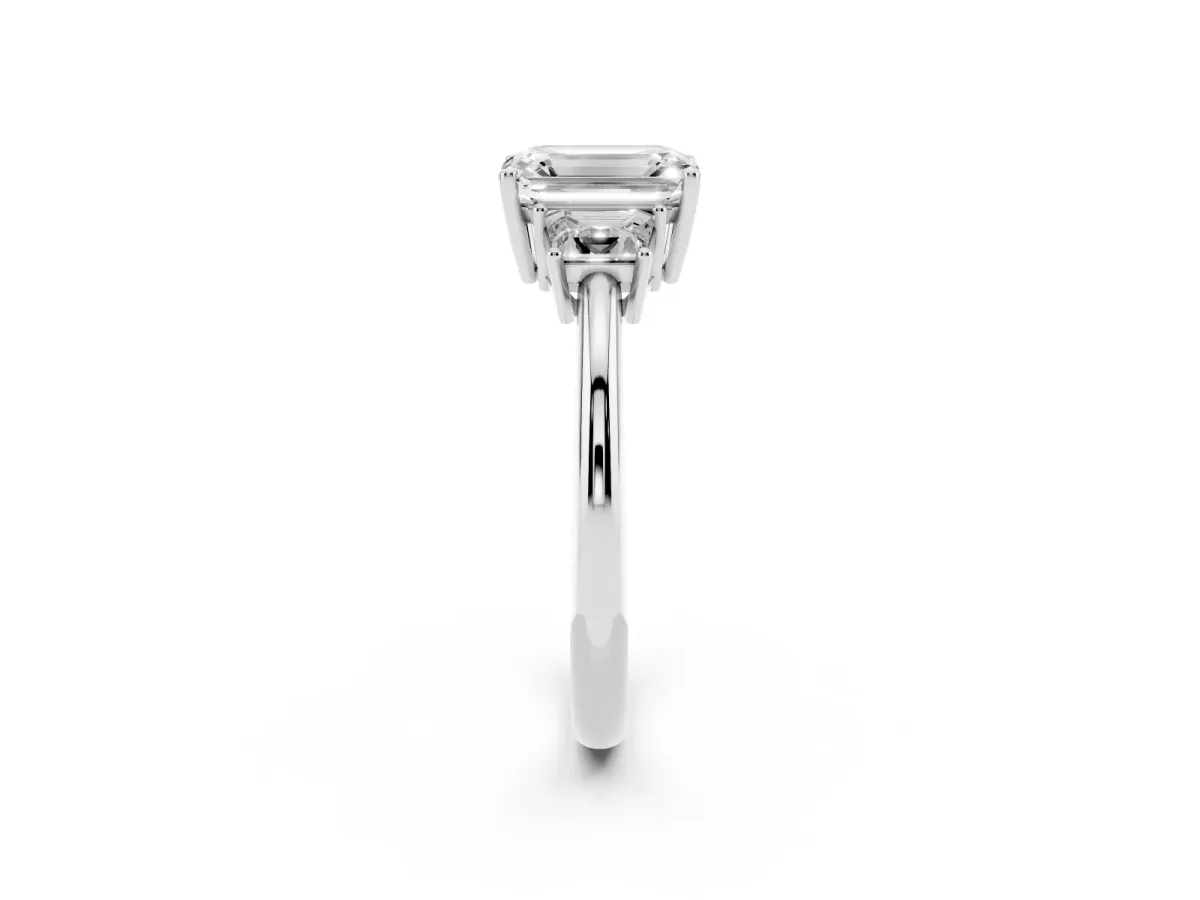 Emerald Cut Diamond Three-Stone Ring with Trapezoid Side Stones and Prong Setting White gold