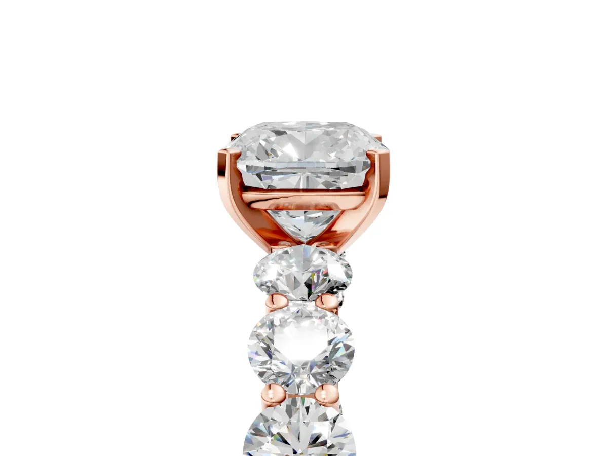Cushion Cut Diamond Prong Setting with Side Stones on a Pave Band Rose gold