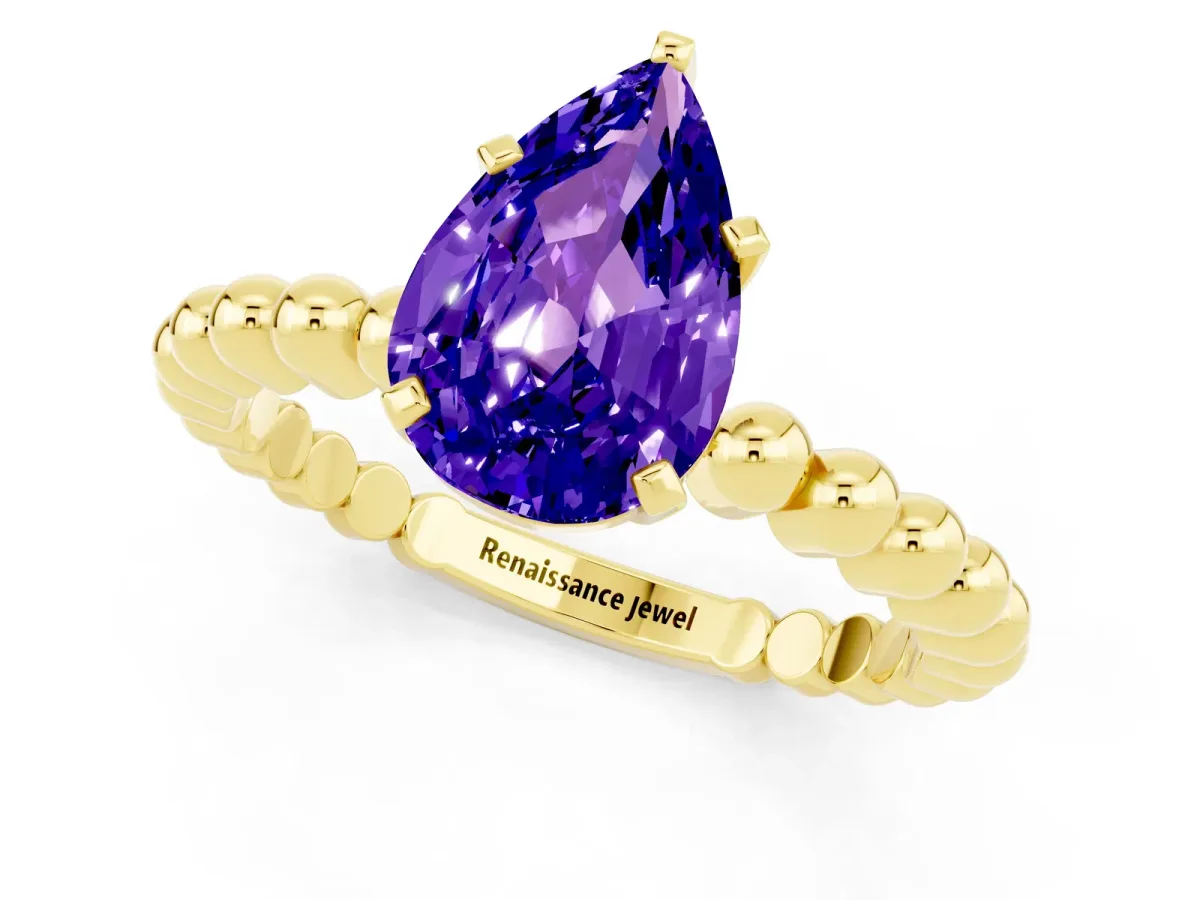 Pear Cut Tanzanite Solitaire Ring with Beaded Band and Prong Setting Yellow gold