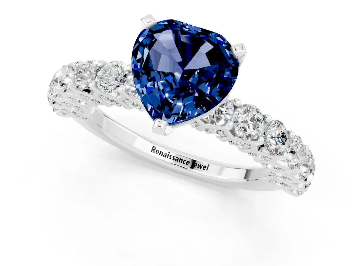 Heart Cut Blue Sapphire Solitaire Ring with Shared Prong Pavé Band and Four-Prong Setting Silver