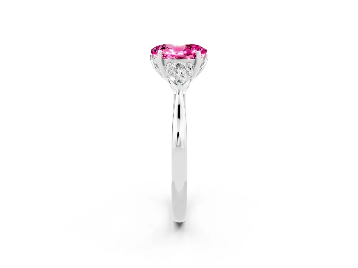 Three-Stone Oval Cut Pink Sapphire Ring with Pear Side Stones in Four-Prong Setting White gold