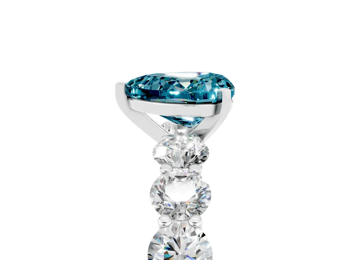 Heart Cut Blue Topaz Prong Setting with Side Stones on a Pave Band Silver
