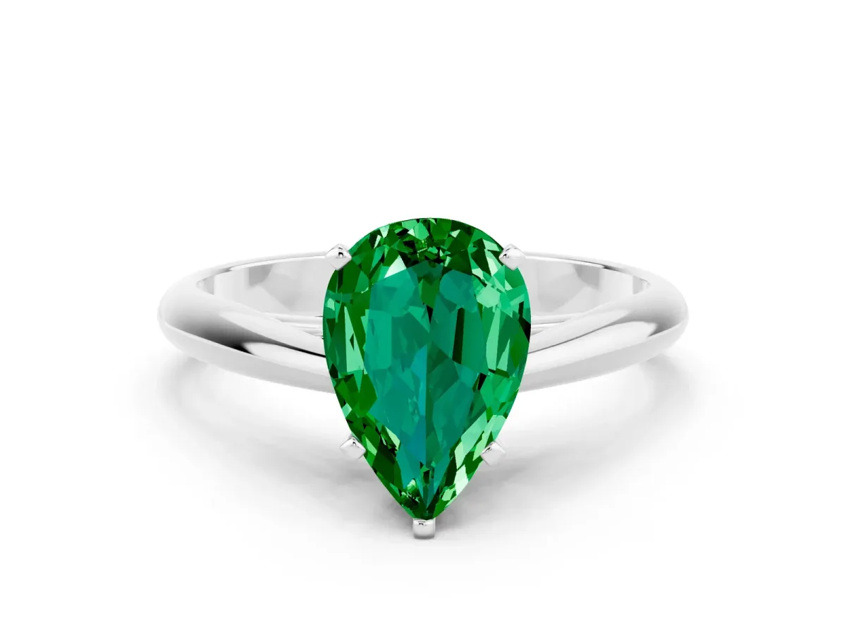 Pear Cut Emerald Solitaire Engagement Ring with Cathedral Setting and Four-Prong Mount White gold