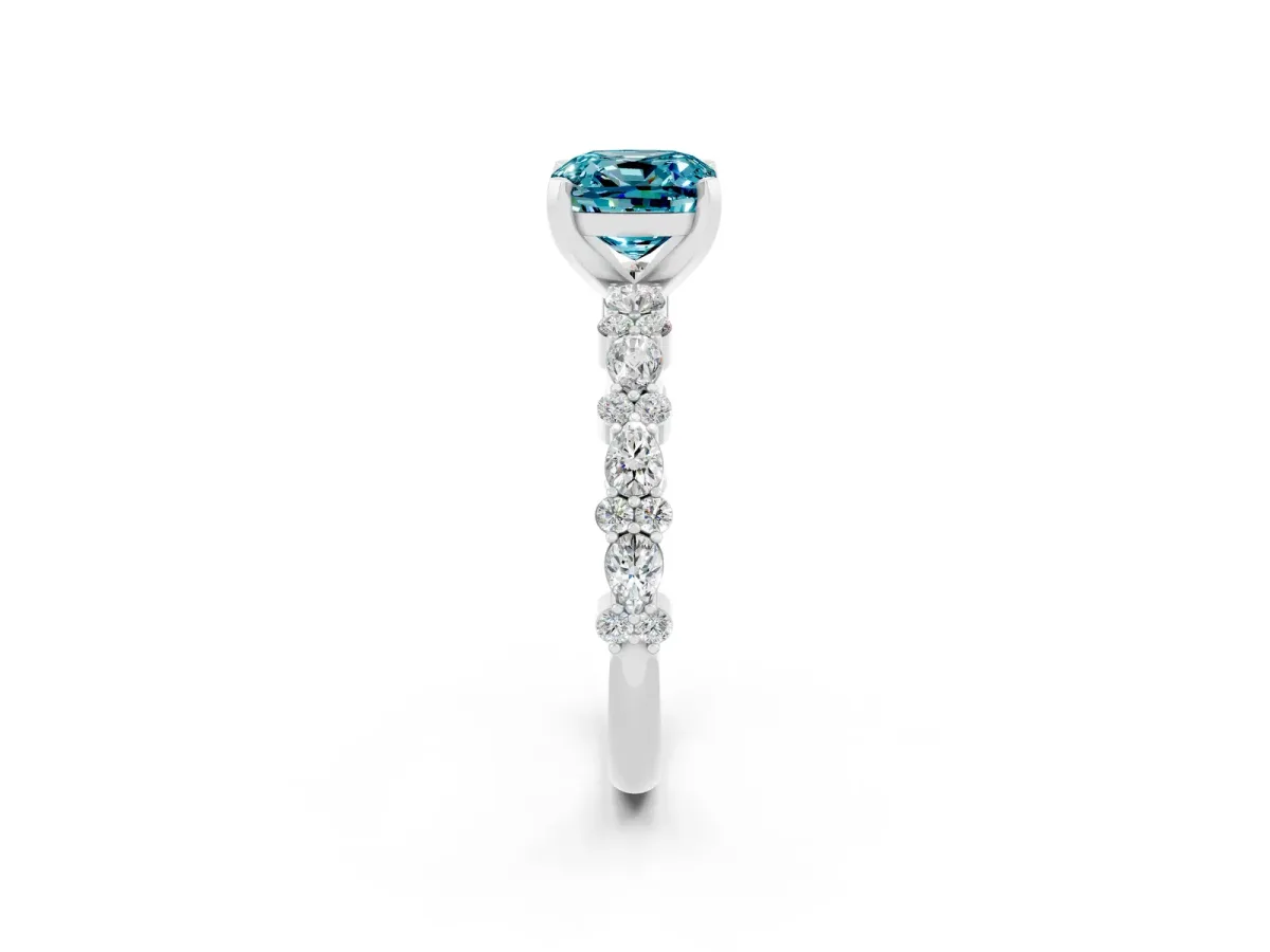 Cushion Cut Blue Topaz Side Stone Solitaire Ring with Round and Four-Prong Setting Platinum